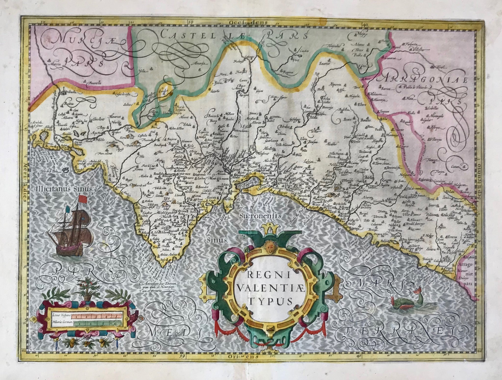 "Regni Valentiae Typus". Province of Valencia, Spain. Copper etching from the atlas by J. Janssonius. Original hand coloring. Amsterdam, ca. 1650.  Map shows coastline of the province of Valencia and the hinterland. Two decorative cartouches, ship and sea monster. Riverse side text in German.