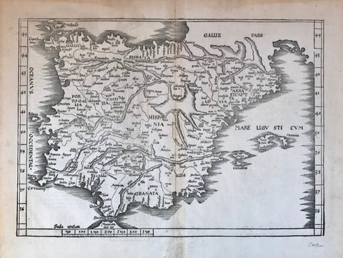 "No Title" . Woodcut from "Claudii Ptolemaie Alexandrini... Geographiae", by Martin Waldseemüller-Laurent Fries. Published in Strasbourg, 1525. (After editions of 1513 and 1522 by Waldseemüller).  This very attractive Potolemic map shows the Iberian penninsula with the Balearic Islands. On the sides are narrow borders showing degrees of latitude, that are not drawn on map. At the bottom is an Italian distance legend. Verso: Text in Latin.