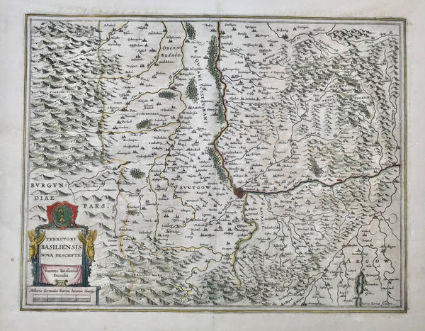 "Territory Basiliensis nova descriptio". Copper etching by Peter Kaerius and ed. by Johann Janssonius, amsterdam, ca 1650. Original hand coloring.  Basel is right in the center of this 3-country region. In the upper left is part of Alsass and northern Burgundy. In the northeast, enclosed by the Rhine river, is the Black Forest of Germany. The lower part of the map is Switzerland. The course of the rhine is from Waldshut in the east as far north as Breisach. Notice the topographical detail on this map.