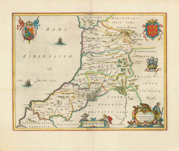 "Ceretica; sive Cardiganensis Comitatus; Anglis Cardigan Shire." Copper etching by Wilhelm Janzoon Blaeu. Amsterdam, 1645. Hand coloring.  This map features CardiganShire on the west coast of Wales. This map is also decorated with various coats-of-arms and an ornamental title cartouche surrounded by a hunter and various animals. The legend at the bottom is held by two cherubs. Verso: Text in Spanish.  Original antique print 
